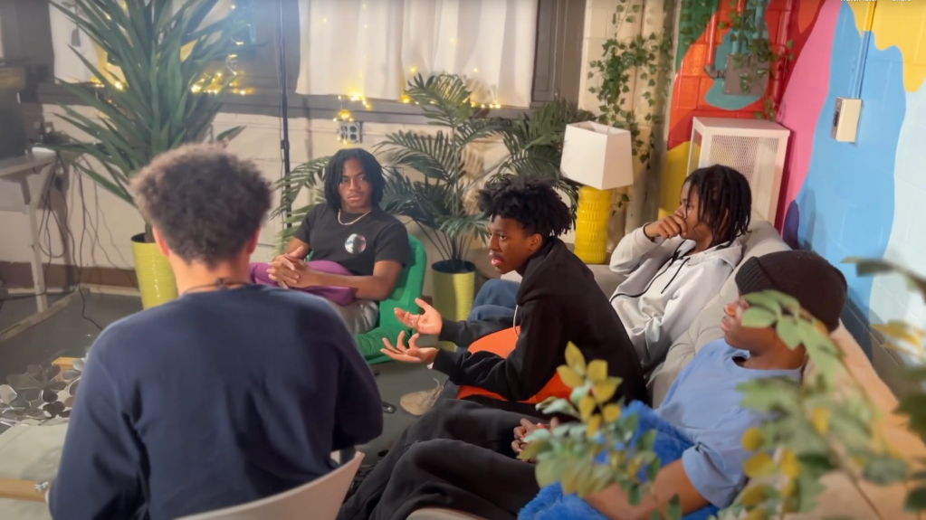 students on couch discussing